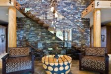 26 rough stone floor adds to the warm rustic cabin look of the entryway
