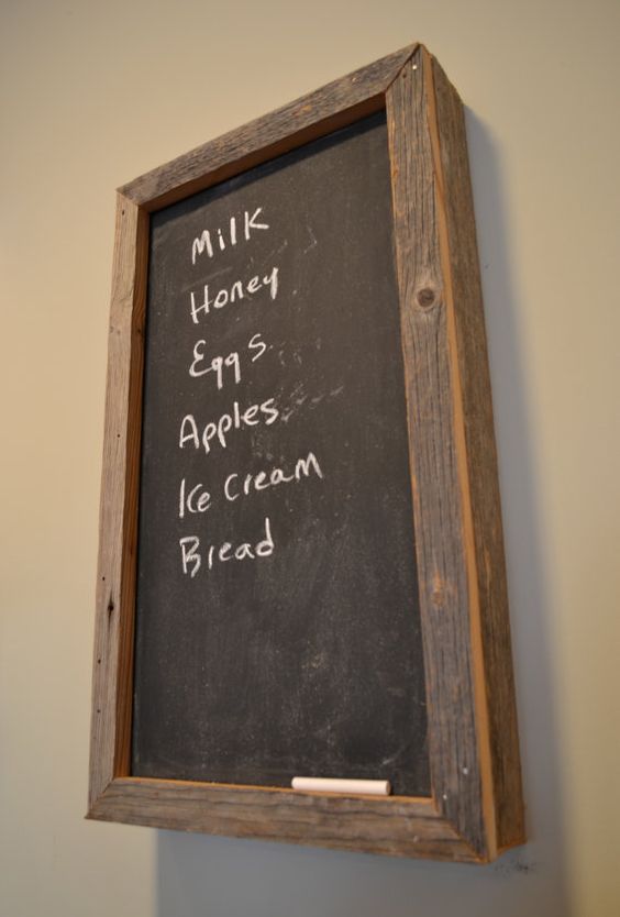 rustic framed chalkboard to hide an electric panel