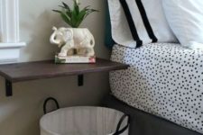 27 wall-mounted bedside table and a basket underneath
