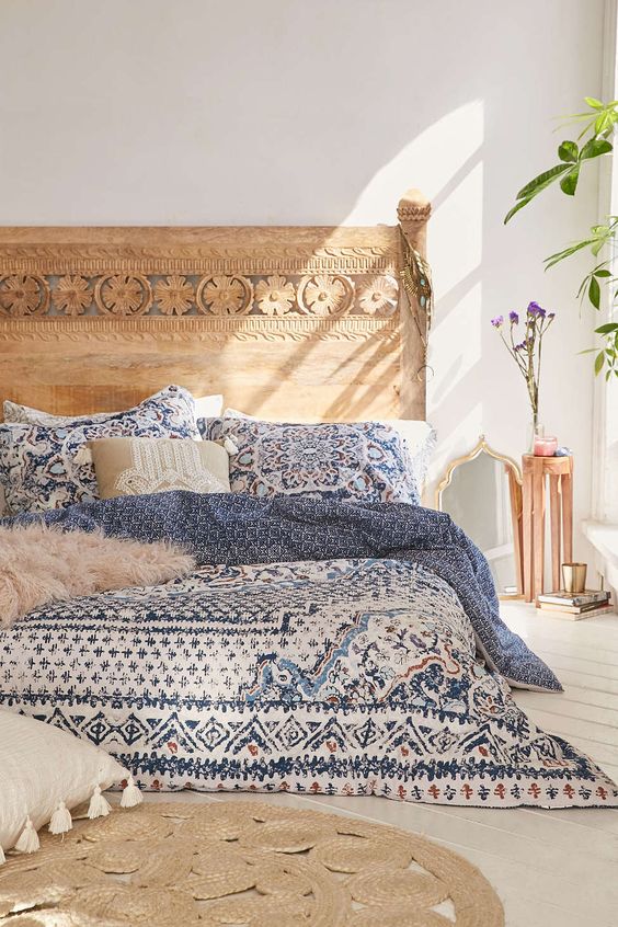 blue bedding and a jute rug
