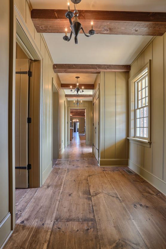 wide plank wood flooring looks cool everywhere, from an entry to a bedroom