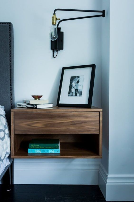 cool modern nightstand with a drawer completes the bedorom decor