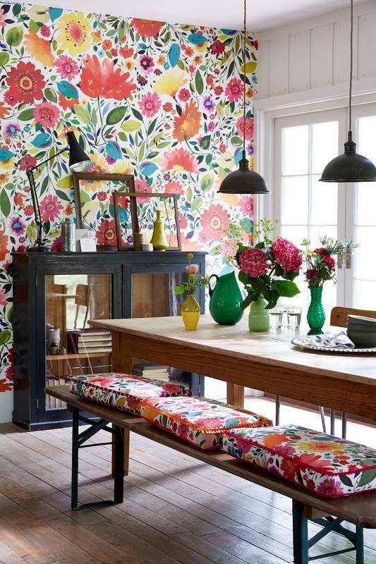 bold watercolor floral wallpaper and the same cushions