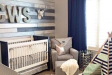 30 metallic wood wall perfectly accentuates a navy and grey nursery
