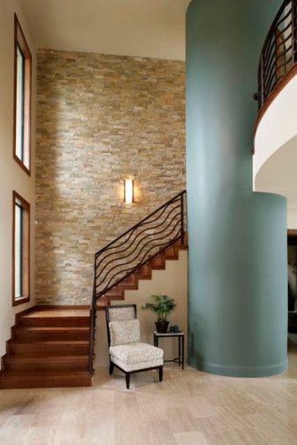 Stacked stone wall in the hallway with a sea inspired pillar