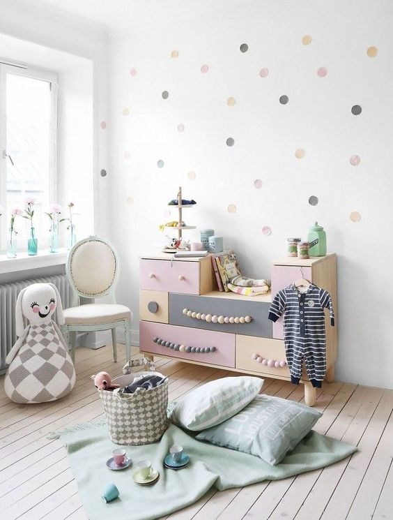 pastel sideboard with wooden bed handles for a little girl