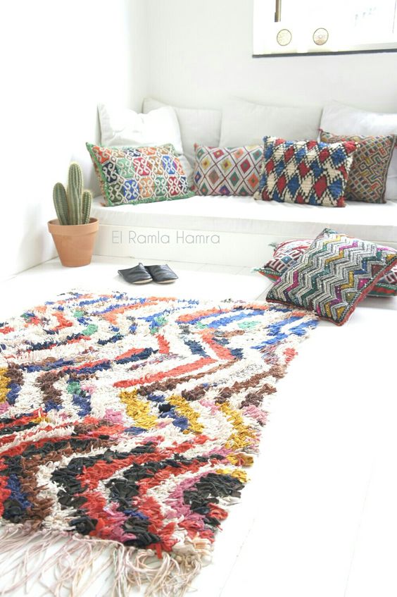 vintage Moroccan boucherouite rug and kilim cushions