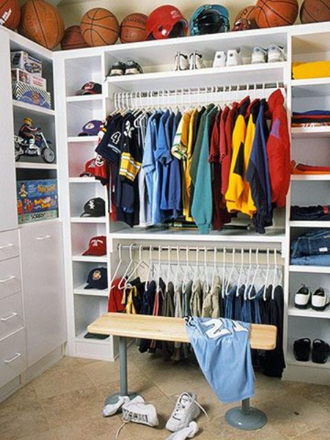 boy's closet with open shelving for balls above