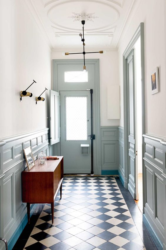 pale serenity wainscoting and frames all around the hallway