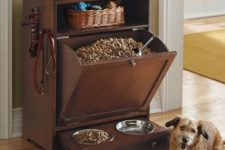 46 dog feeding station with a tilt-out drawer for food and bowls