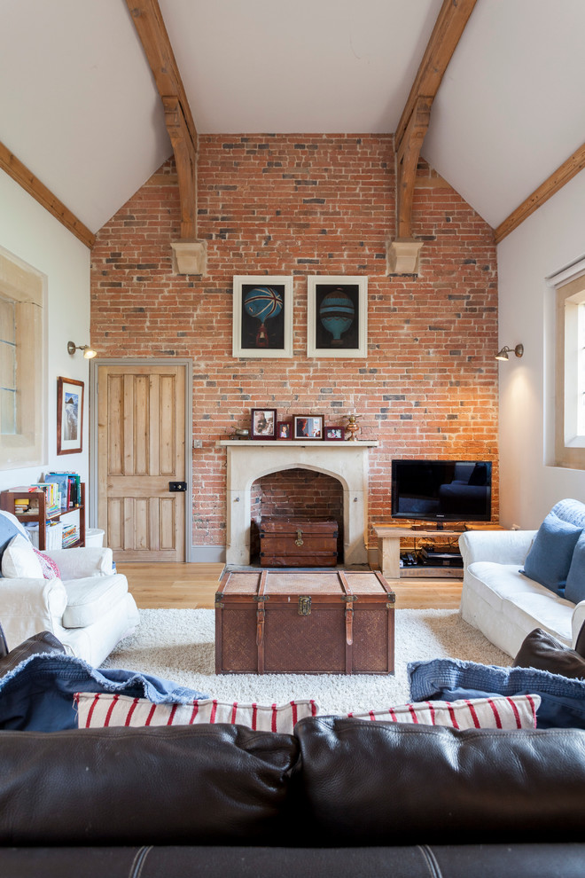 Even if a fireplace isn't functional and simply serves as an element of decor, a brick wall is a cool idea to surround it. (Chris Snook)