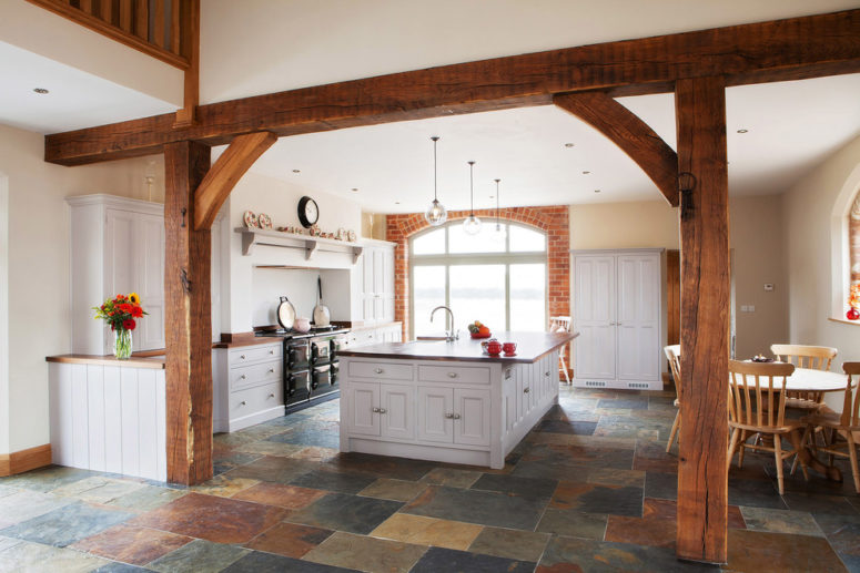 Barn-inspired interiors looks great with natural stone-inspired tiles. (Hill Farm Furniture Ltd)