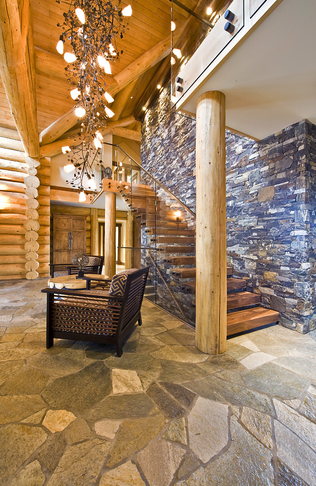 This cozy space features only natural materials and is a great example of a remote cabin interior.  (Sticks + Stones Design Group inc.)