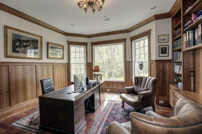 Wood wainscoting looks great combined with wood trimmings and furniture in this gorgeous home office.