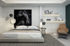 01 The master bedroom is clad with whitewashed wood and there’s a cool oversized black and white artwork