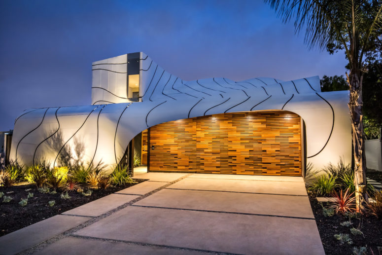 This unique Wave House by architect Mario Romano in inspired by the ocean waves and looks fantastic