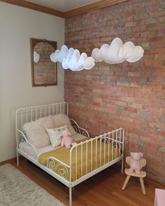 exposed brick wall and felt clouds to soften the look