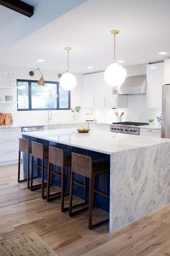 mid-century modern kitchen reveal with a clean pristine marble countertop
