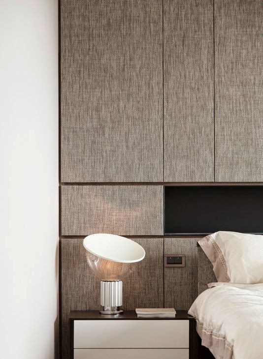 rough fabric texture on the headboard wall spruces up a laconic bedroom