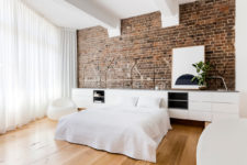 bedroom with a brick wall