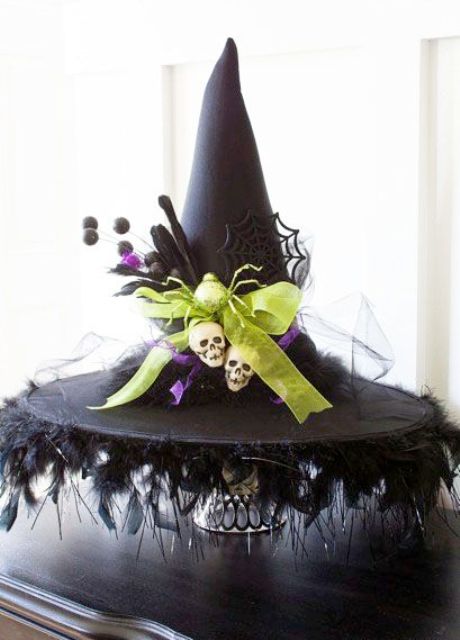 DIY witch hat decoration with skulls and spider web