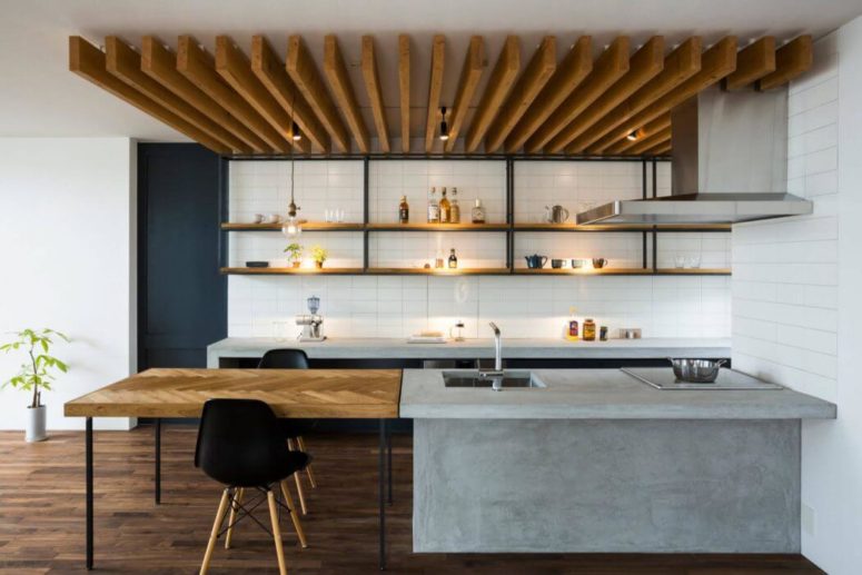 The ceiling is decorated with wooden planks, and the tabletop is clad in chevron pattern