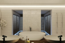 03 The master bathroom is clad with white marble and wood, there’s a free-standing bathtub