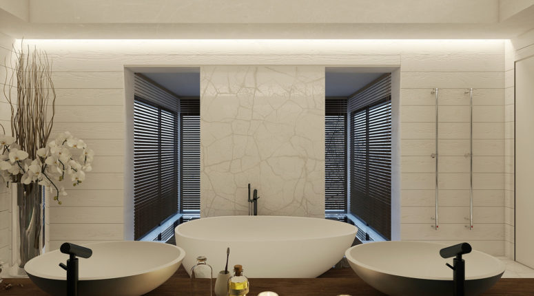 The master bathroom is clad with white marble and wood, there's a free-standing bathtub