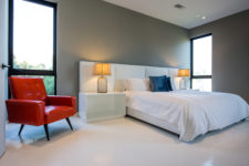 04 The bedroom is decorated in minimalist style with just a couple of bold accents