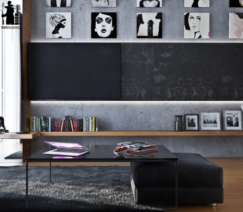 The concrete walls and a black and white gallery wall keep the decor theme