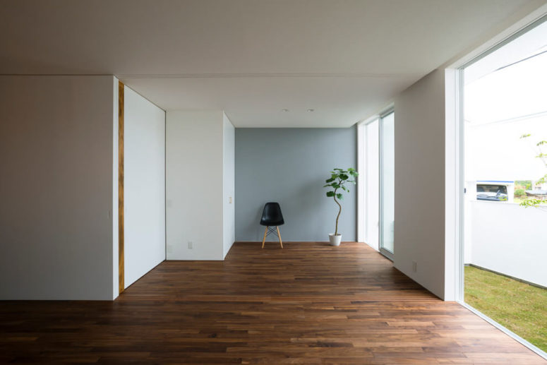 The walls are white, and beautiful wood-clad floors make the space more interesting