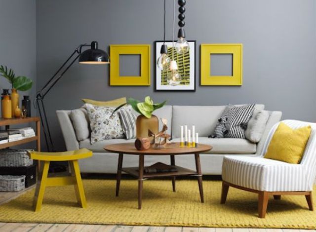 gunmetal grey contrasts with yellow frames, a rug and a stool