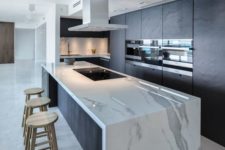 05 open layouts strive for waterfall countertops that hide the appliances and keep the space tidy