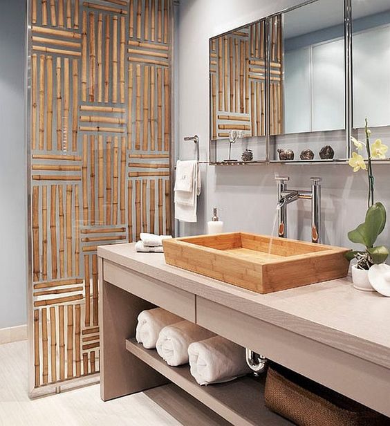 Asian-styled bathroom with light blue walls and a spa feel