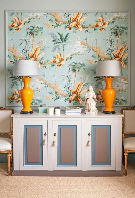 Bold wallpaper was framed as an artwork and the sideboard was designed by Chrapka to match
