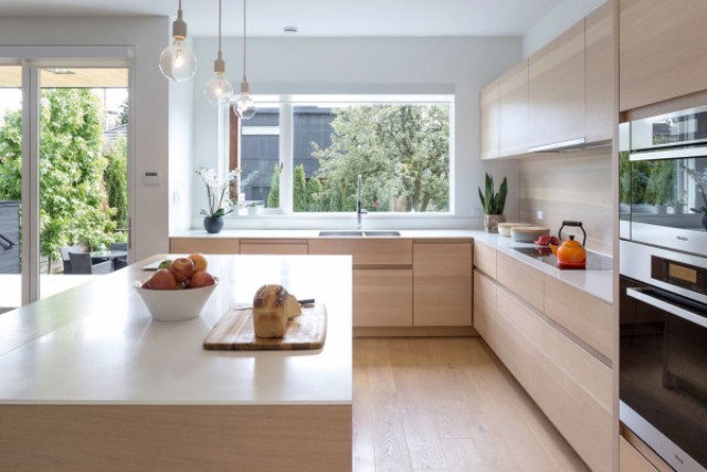 The countertops are white and the space looks totally uncluttered, sleek and modern