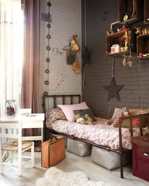 a brown and white brick wall is a nice solution for this kid's room