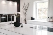 06 all-white kitchen with a couple of black touches looks laconically Scandinavian