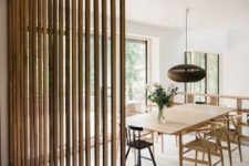 06 wooden plank screens separate areas and add texture to the interior