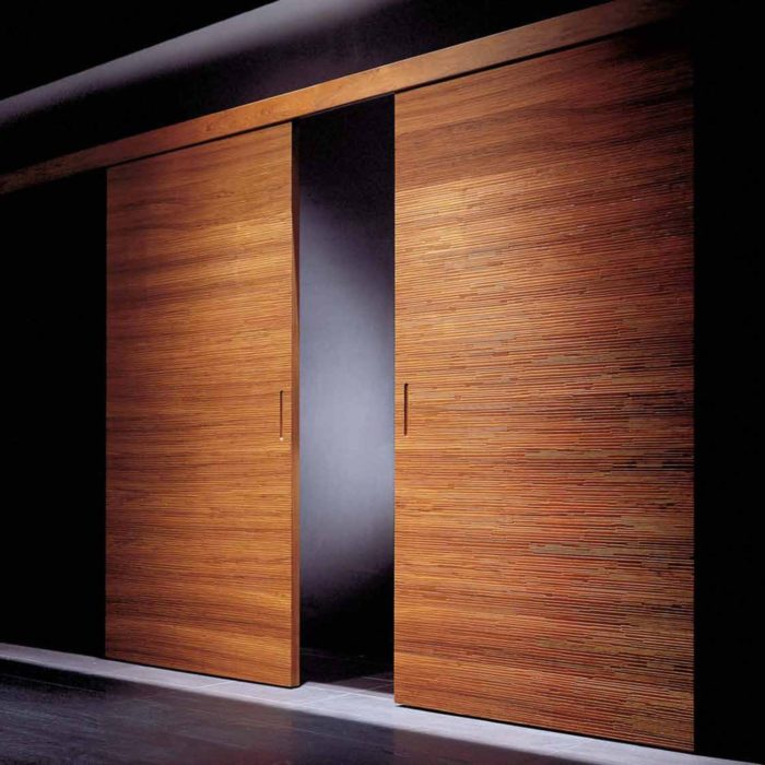 There are sliding doors for larger entrances, they have rich wood tones