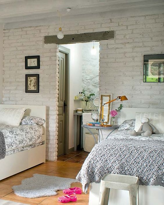 white brick wall for a shared girls' bedroom