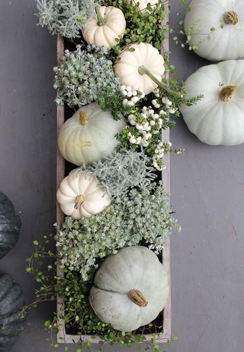 neutral box centerpiece with pumpkins and greenery