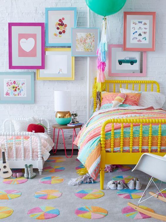 shared girls' room with lots of color and a whitewashed headboard wall