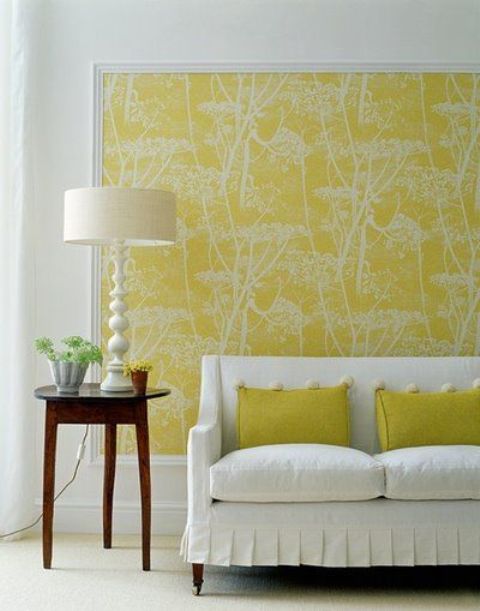 stick fabric on the wall with liquid starch, frame it with trim board to make it look like large wall art