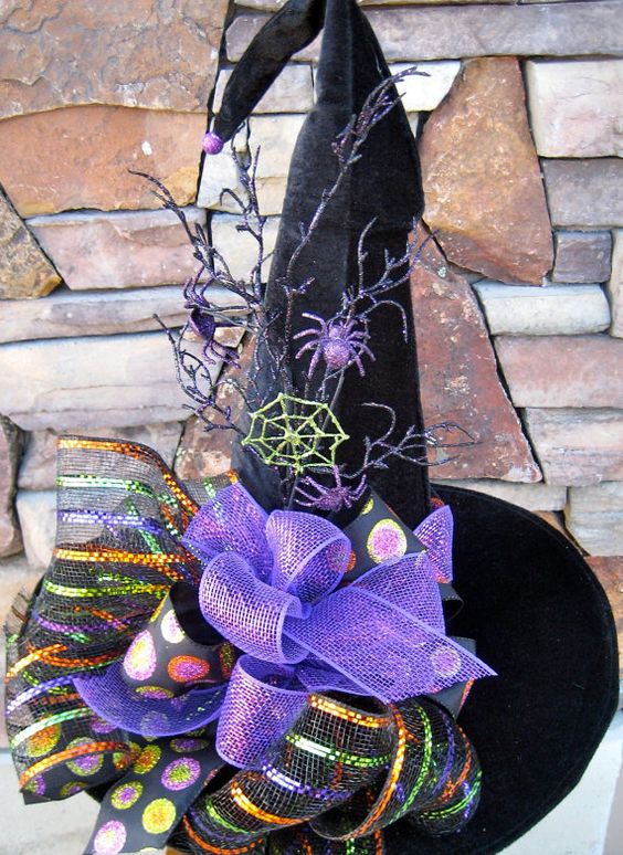 velvet witch's hat with purple decor and spiders