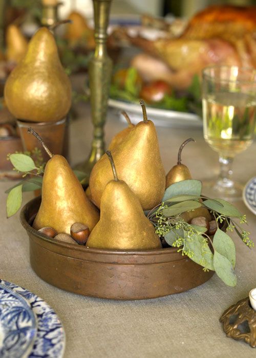 gold pear and acorns centerpiece in a bowl