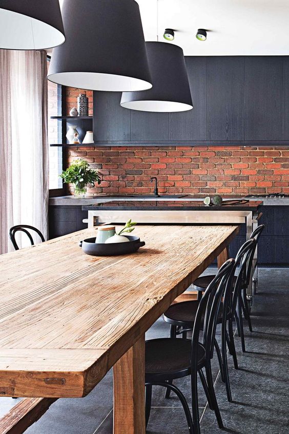 masculine kitchen of dark grey with modern red brick clad