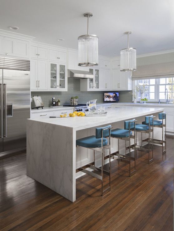 White marble looking granite is durable and bring a modern vibe to these shaker cabinets