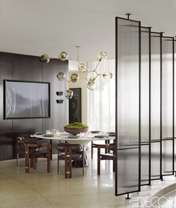 narrow framed glass screens add to the decor and separate areas without looking too bulky