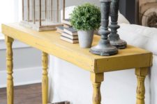 12 a distressed yellow onsole table will stand out in a grey living room